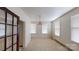 Simple dining room with hardwood floors and chandelier at 309 Elm St, Marshville, NC 28103