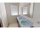 Bathroom with double sinks and window at 309 Elm St, Marshville, NC 28103