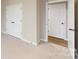 Bedroom with carpet, double door closet and access to another room at 7089 Cobblefield Ln, Denver, NC 28037