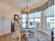 Charming breakfast nook with bay window and round table at 82220 Standing Oak Dr, Charlotte, NC 28278