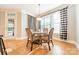 Breakfast nook with glass-top table and wicker chairs at 293 Bayberry Creek Cir, Mooresville, NC 28117