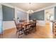 Spacious dining area with hardwood floors and view into the kitchen at 293 Bayberry Creek Cir, Mooresville, NC 28117