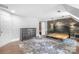 Spacious bedroom with wood-like accent wall and large, plush rug at 10320 Berkeley Pond Dr, Charlotte, NC 28277