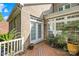 Brick home with deck, potted plants, and access door at 10320 Berkeley Pond Dr, Charlotte, NC 28277