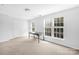 Bright bedroom with neutral decor, double-door closet, and built-in desk at 10320 Berkeley Pond Dr, Charlotte, NC 28277