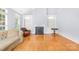 Living room featuring hardwood floors, a fireplace and built-in shelving at 10320 Berkeley Pond Dr, Charlotte, NC 28277