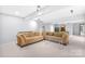 Finished basement with sectional sofa, glass coffee table, and pool table at 10320 Berkeley Pond Dr, Charlotte, NC 28277