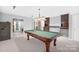 Basement game room features a pool table, wet bar, and plenty of storage at 10320 Berkeley Pond Dr, Charlotte, NC 28277