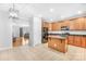 Kitchen with island, stainless steel appliances, and wood cabinets at 10320 Berkeley Pond Dr, Charlotte, NC 28277