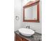 Elegant bathroom with granite vanity and a decorative mirror at 10320 Berkeley Pond Dr, Charlotte, NC 28277