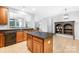Kitchen with island, granite countertops, and wood cabinets at 10320 Berkeley Pond Dr, Charlotte, NC 28277