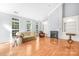 Living room with hardwood floors, fireplace, and built-in shelving at 10320 Berkeley Pond Dr, Charlotte, NC 28277