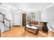 Living room with hardwood floors and a view to the entryway at 10320 Berkeley Pond Dr, Charlotte, NC 28277