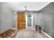 Basement recreation room with barn door and comfy seating at 10320 Berkeley Pond Dr, Charlotte, NC 28277