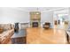 Living room with hardwood floors, stone fireplace, and comfortable seating at 10320 Berkeley Pond Dr, Charlotte, NC 28277