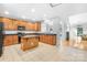 Kitchen with an island, hardwood floors, and ample cabinetry at 10320 Berkeley Pond Dr, Charlotte, NC 28277