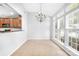 Bright breakfast nook with large windows and a chandelier at 10320 Berkeley Pond Dr, Charlotte, NC 28277