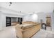 Finished basement with sectional sofa, entertainment center, and pool table at 10320 Berkeley Pond Dr, Charlotte, NC 28277