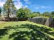 Private backyard with a grassy area and wooden fence at 916 Mcalway Rd # D, Charlotte, NC 28211