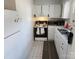 Small kitchen with white cabinets and appliances at 916 Mcalway Rd # D, Charlotte, NC 28211