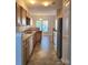 Modern kitchen with stainless steel appliances and wood cabinets at 7945 Mariners Pointe Cir, Denver, NC 28037
