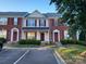 Brick front of charming townhome with landscaping at 7945 Mariners Pointe Cir, Denver, NC 28037