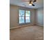 Well-lit bedroom with neutral walls, carpet and large windows at 7945 Mariners Pointe Cir, Denver, NC 28037