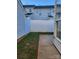 Small backyard with grassy area and patio at 7945 Mariners Pointe Cir, Denver, NC 28037