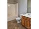 Clean bathroom with wood vanity and tile flooring at 7945 Mariners Pointe Cir, Denver, NC 28037