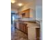 Kitchen with wood cabinets, light countertops, and a double sink at 7945 Mariners Pointe Cir, Denver, NC 28037
