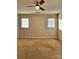 Spacious bedroom with neutral walls, carpet and ceiling fan at 7945 Mariners Pointe Cir, Denver, NC 28037