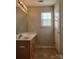 Bathroom with wood vanity, tile flooring and a window at 7945 Mariners Pointe Cir, Denver, NC 28037