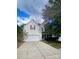 Two-story house with attached garage and landscaped yard at 9816 Cayenne Dr, Charlotte, NC 28214