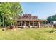 Rustic-style home with a large front porch and antique decor at 5067 E Dixon Blvd, Kings Mountain, NC 28086