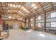 Large workshop featuring high ceilings, an array of tools, and plenty of storage space at 5067 E Dixon Blvd, Kings Mountain, NC 28086