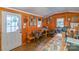 Office space with wooden walls, desk, chairs, and framed photos at 5067 E Dixon Blvd, Kings Mountain, NC 28086