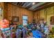 Large living area with natural light and various furniture and storage items at 5067 E Dixon Blvd, Kings Mountain, NC 28086