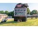 Antique shop sign with car and bicycle display at 5067 E Dixon Blvd, Kings Mountain, NC 28086