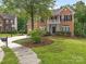 Brick two-story home with landscaped yard and driveway at 1120 Red Porch Ln, Matthews, NC 28105