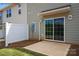 Private patio with sliding glass door access and a small concrete slab at 5151 Tommy Ln # 1103, Stanley, NC 28164