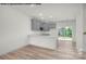 Modern kitchen with gray cabinets, island, and stainless steel appliances at 5151 Tommy Ln # 1103, Stanley, NC 28164