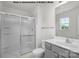 Clean bathroom featuring a shower, toilet, and vanity with gray cabinets at 5151 Tommy Ln # 1103, Stanley, NC 28164