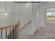 Upstairs hallway with carpet and access to bedrooms at 5151 Tommy Ln # 1103, Stanley, NC 28164