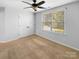 Well-lit bedroom featuring carpet, double doors to closet, and a window at 10305 Shrader Nw St, Concord, NC 28027