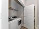 Convenient laundry room with washer, dryer, and shelving at 8707 Nolley Ct, Charlotte, NC 28270