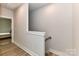 Upstairs hallway with access to bedrooms and stairs at 8707 Nolley Ct, Charlotte, NC 28270