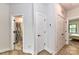 Hallway with doors to bedrooms and a bathroom at 8707 Nolley Ct, Charlotte, NC 28270