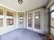 Covered porch with french doors and screened enclosure at 322 Muirfield Way, Salisbury, NC 28144