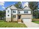 Two-story home with gray siding and brick accents at 3192 Timber Run Ln, Maiden, NC 28650