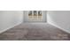 Well-lit bedroom featuring carpet and a window view at 3192 Timber Run Ln, Maiden, NC 28650